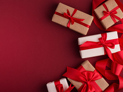 Boxing Day Sale concept with boxes tight with silk red bows, top view and empty copy space.