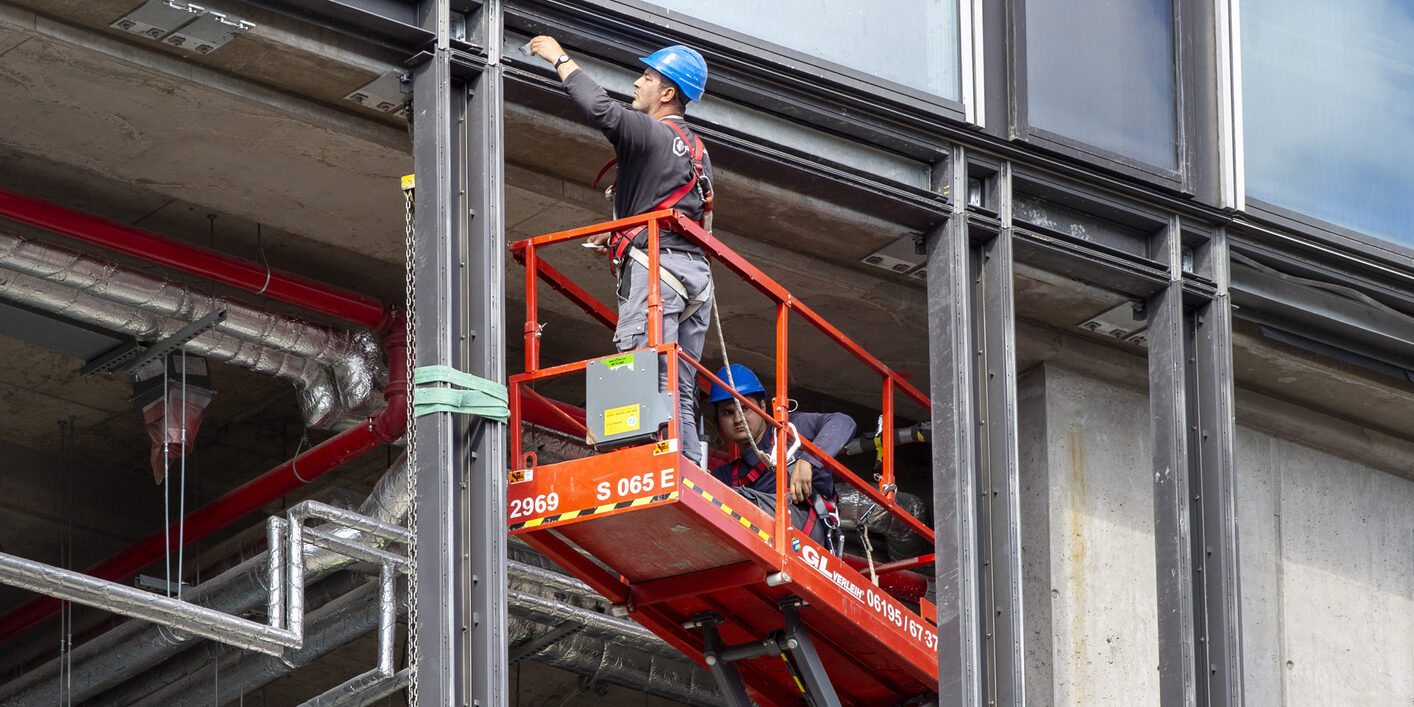 Frankfurt, Germany - September 30, 2022: Building worker on construction site of a skyscraper in the city center of Frankfurt, Germany